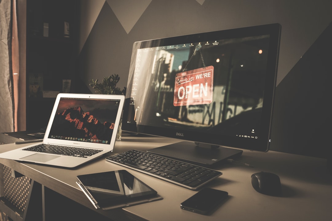 a-laptop-computer-sitting-on-top-of-a-desk-mndu3sh2j8m